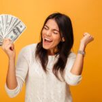 A happy woman saving money with free junk removal in St. Paul, MN
